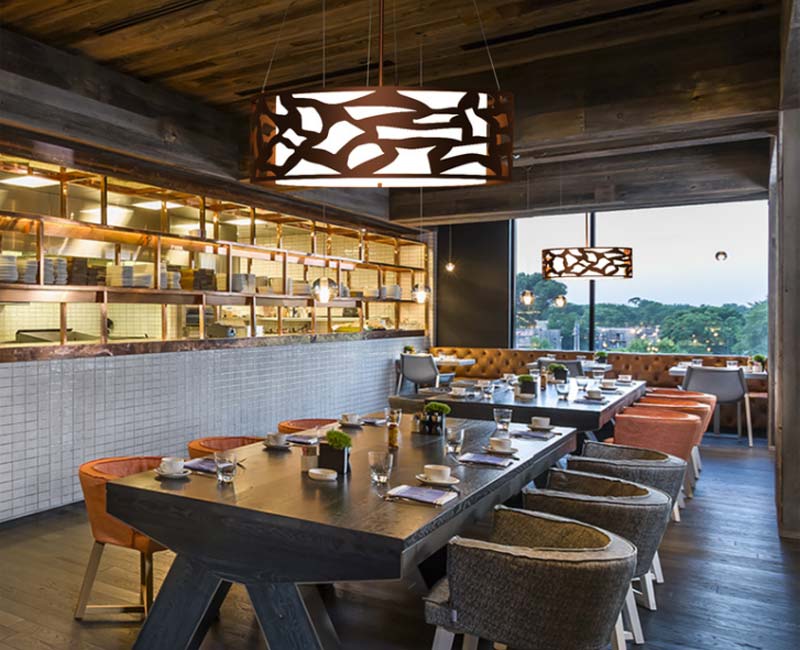 carmel pendant product hanging from ceiling in restaurant